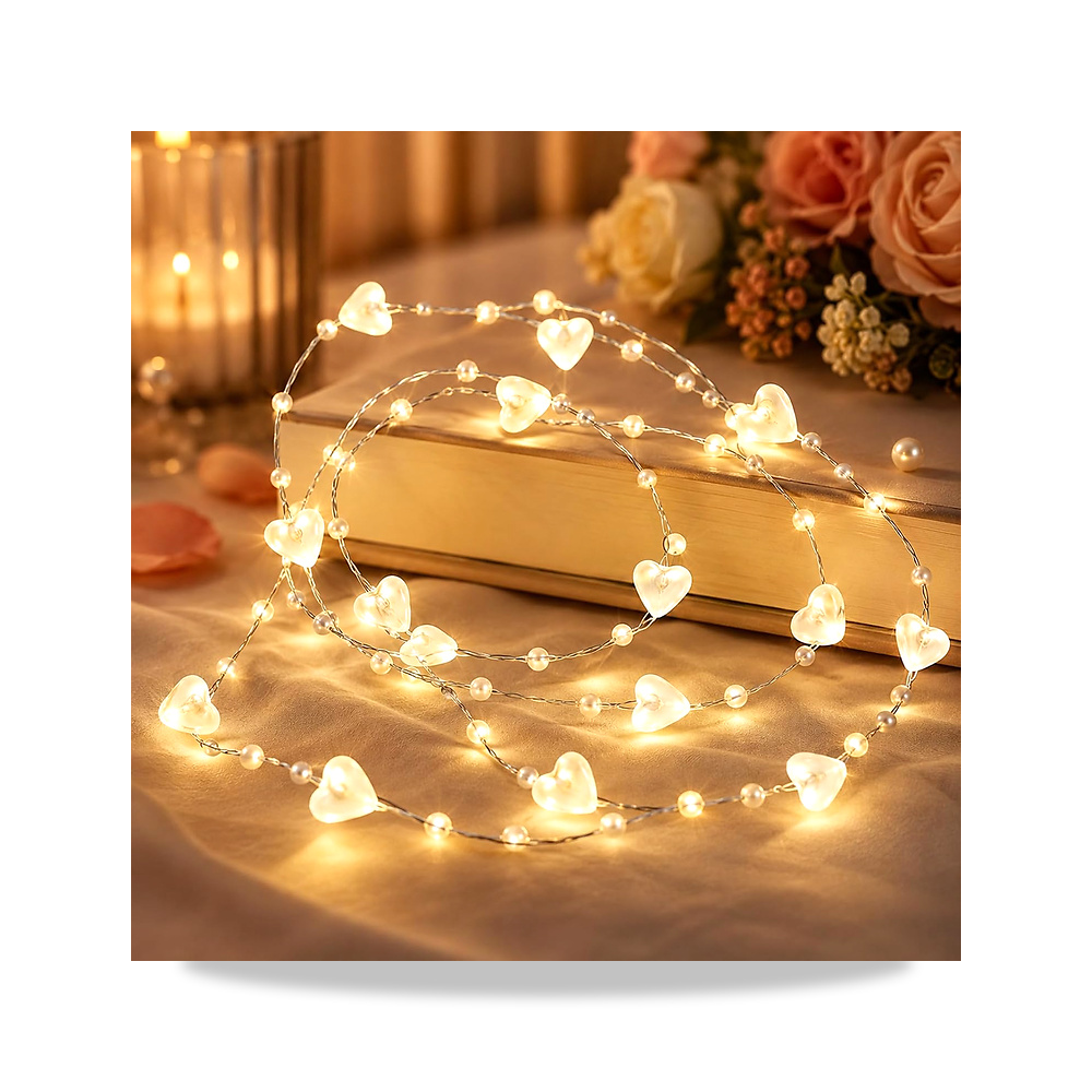 صورة منتج سلسلة مصابيح LED من انليس مع خرز وقلوب بلون ابيض دافئ بطول 1 متر و10 LED تعمل بالبطارية اينليس - كود الصنف reemco-2027-1537351 - ماركة يباع من خلال reemco - توريد وتصوير حصري لشركة ريمكو القابضة السعودية
